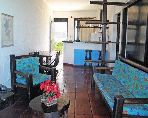 An open plan living dining and kitchen area with a patio.