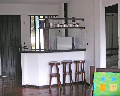 A well equipped kitchen with breakfast bar.
