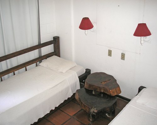 A well furnished bedroom with two beds.