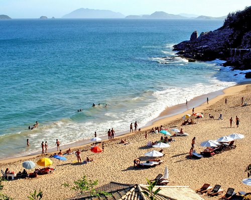 An aerial view of a beach alongside the ocean.