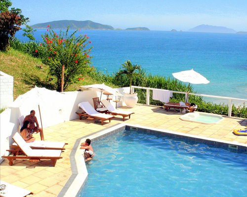 Outdoor swimming pool overlooking the ocean.