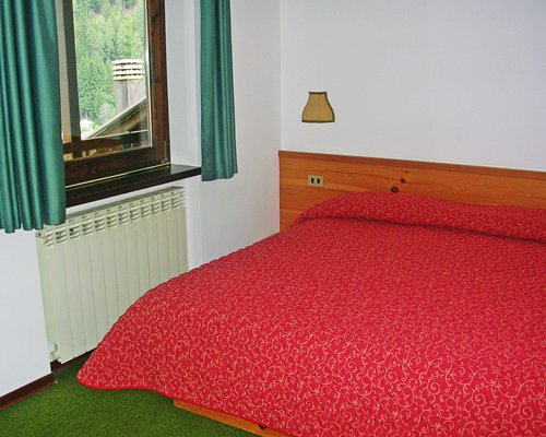 A well furnished bedroom with a television.