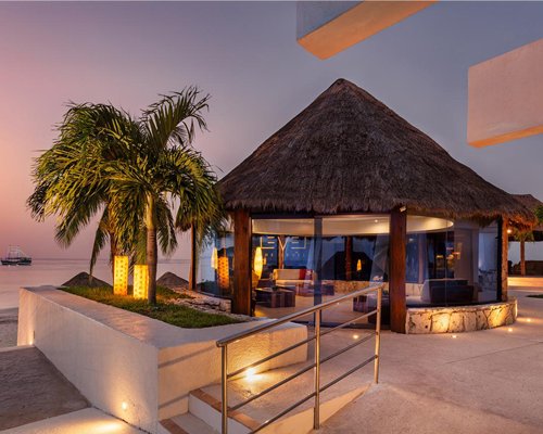 A view of the poolside bar alongside the ocean.