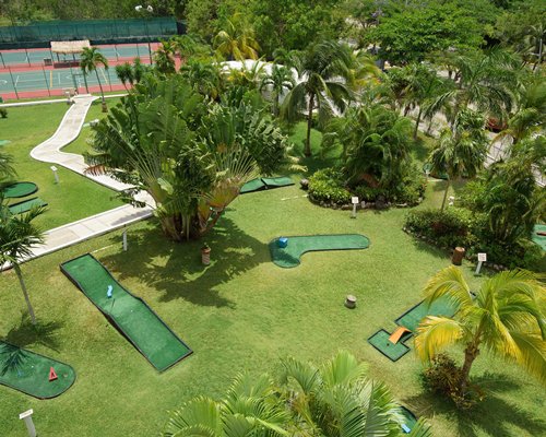 An outdoor swimming pool alongside the sea.