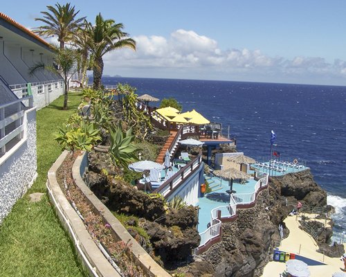 A scenic exterior view of the resort property alongside the ocean.