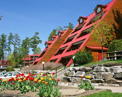 Scenic exterior view of multi story resort units with a parking lot.