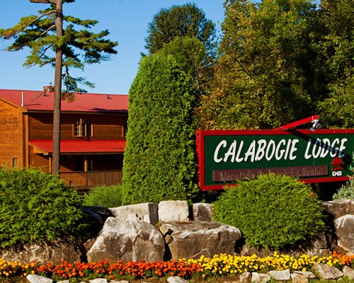 Signboard of Calabogie Lodge Resort surrounded by trees.