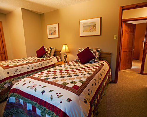 A well furnished bedroom with two twin beds.
