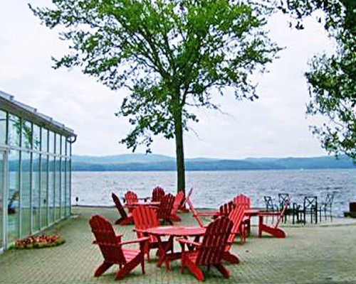 A view of the outdoor patio furniture alongside the lake.