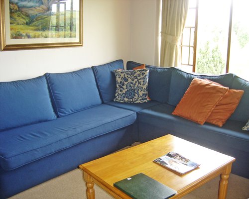 A well furnished living room with double pull out sofa.
