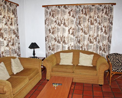 A well furnished living room with a double pull out sofa.