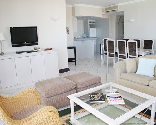 An open plan living and dining area with a television.
