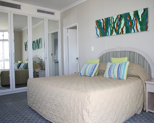 A well furnished bedroom with king bed.