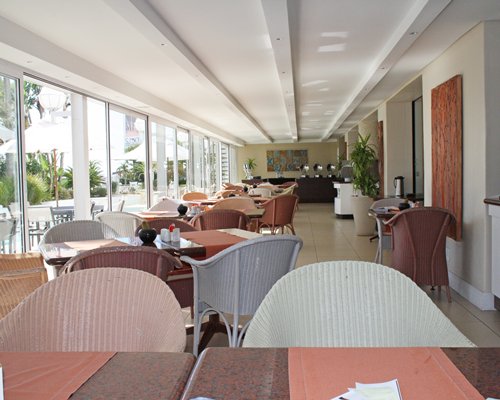 An indoor fine dining restaurant with an outside view.