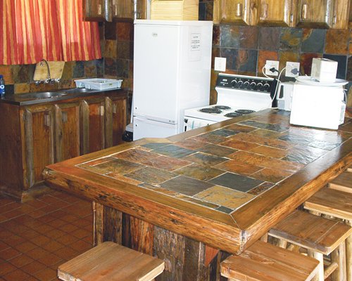 A well equipped kitchen with dining area.