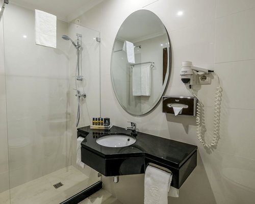 A well furnished bedroom with a double bed and a cupboard.