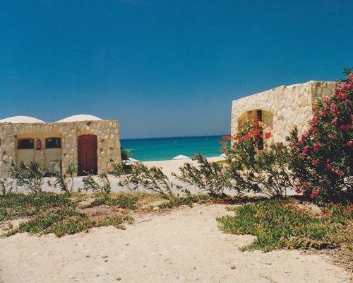 Exterior view of units at Moon Beach Club alongside the beach.