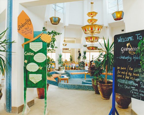 Entrance to an indoor restaurant with signboards.