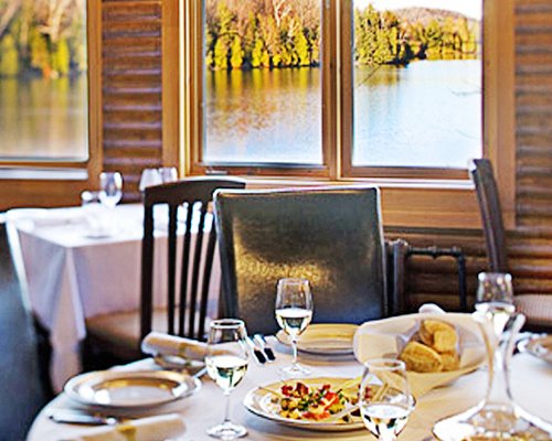 View of food on the table at an indoor restaurant with lake view.