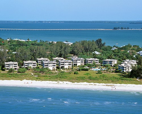 An aerial view of the Shell Island Beach Club Resort alongside the ocean.
