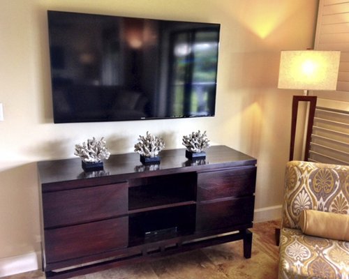 A well furnished living room with a television.