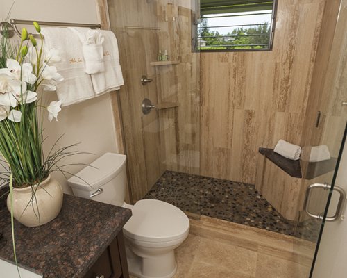 A bathroom with a standing shower.