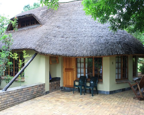 An exterior view of the Champagne Lane with patio furniture.