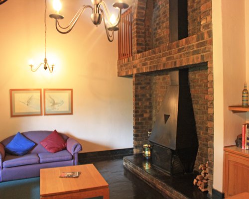 A well furnished living room with a fireplace.