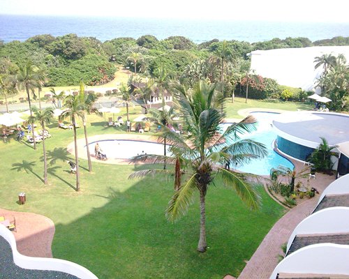 A scenic outdoor swimming pool alongside the resort.
