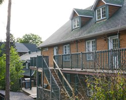 Exterior view of a unit with balcony and stairway at Privilege Mont Tremblant.