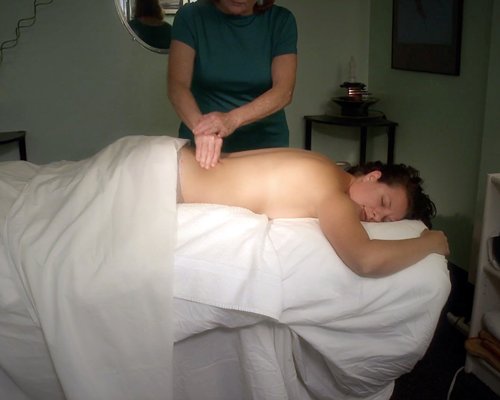 A woman enjoying a massage.