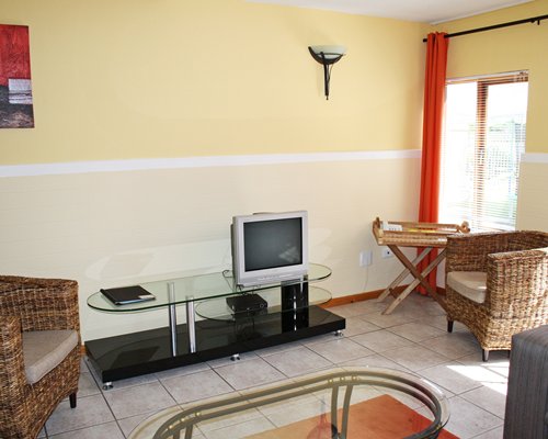 A furnished living room with a television.