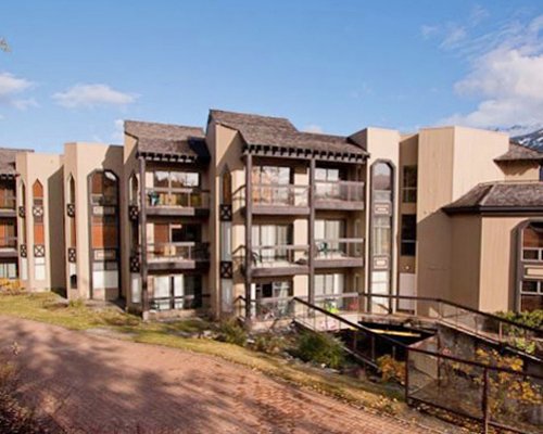 Exterior view of a pathway to multiple units with balconies at Ironwood.
