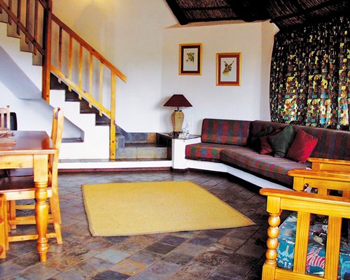 An open plan living and dining area with a staircase.