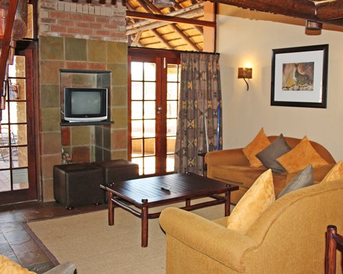 A well furnished living room with a television.