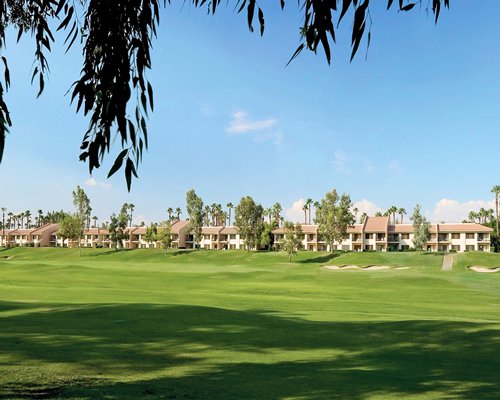 A golf course alongside multiple units at Welk Resorts Palm Springs.