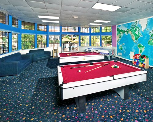 Indoor recreation room with pool tables.