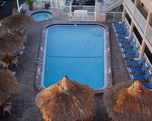 An aerial view of outdoor swimming pool and hot tub.