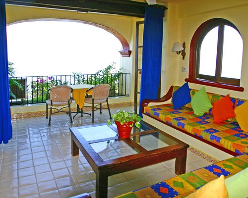 A well furnished living room with balcony.