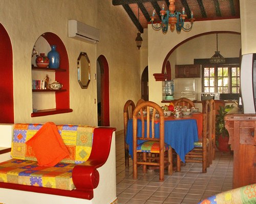 A well furnished living room with a dining area and open plan kitchen.