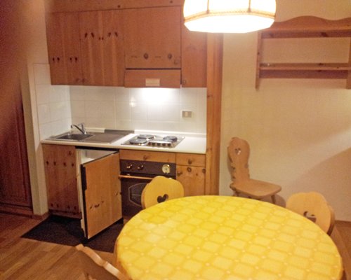A well equipped kitchen with a dining area.