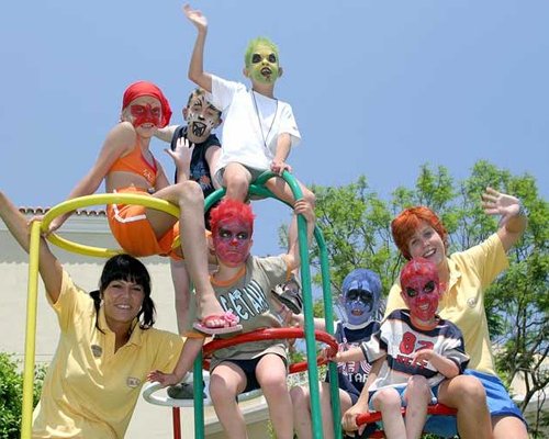 A group of kids playing in a playscape.