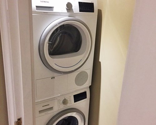 A view of two washing machines.