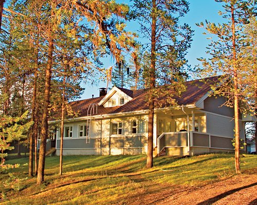 An exterior view of the Holiday Club Kalajoki resort units surrounded by trees.