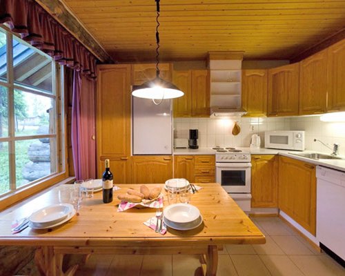 A well equipped kitchen with a dining area.