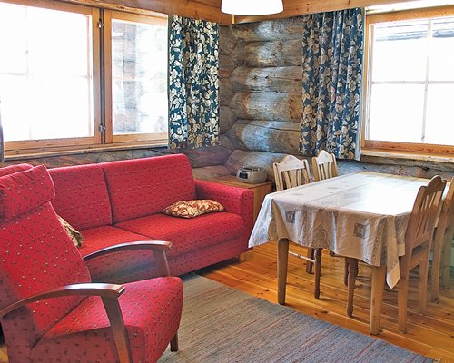 A well furnished living and dining area with an outside view.