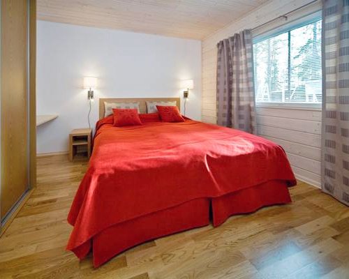 A well furnished bedroom with two beds.