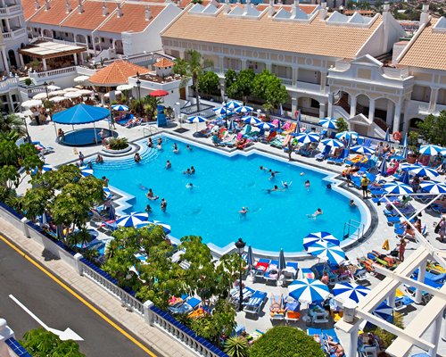 A large outdoor swimming pool alongside the resort.