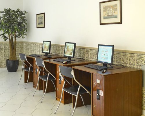 A common room with three computers.