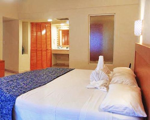A well furnished bedroom with a king bed.